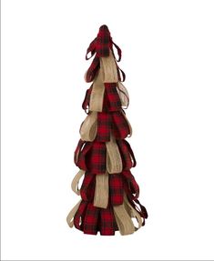 a christmas tree made out of burlocks and plaid ribbon on a white background