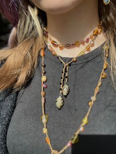 These versatile crochet jewelry wraps can be used as necklaces, brackets, anklets, or anything you can put your mind to - be creative ;) Inspired by jensjewlery on tik tok! Hand crocheted from nylon thread with glass beads. Approx. 31 inches in length. Note: due to the nature of anything handmade details may vary! Handmade Brown Double Strand Jewelry, Handmade Multicolor Lariat Necklace Gift, Handmade Multicolor Lariat Necklace As Gift, Handmade Lariat Festival Necklace, Handmade Festival Lariat Necklace, Handmade Lariat Necklace For Festivals, Handmade Double Strand Amber Jewelry, Hand Wrapped Lariat Necklaces For Gifts, Handmade Long Lariat Necklace For Festivals