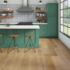 a kitchen with green cabinets and stools in front of an island countertop that has three wooden bar stools on it