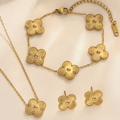 3 Piece Gold Clover Set. Double-Sided Necklace And Bracelet Stainless Steel 18 Kt Gold Plated Hypoallergenic Water Resistant Alhambra Style. Elegant Gold Flower-shaped Jewelry, Gold Plated Flower Shaped Jewelry With Matching Earrings, Elegant Stainless Steel Jewelry Sets As A Gift, Elegant Stainless Steel Jewelry Sets For Gift, Yellow Gold Flower-shaped Jewelry, Tarnish Resistant Stainless Steel Jewelry For Party, Dainty Metal Jewelry In Flower Shape, Dainty Metal Flower Shaped Jewelry, Dainty Metal Flower-shaped Jewelry