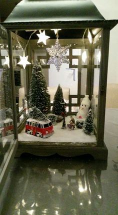 a display case filled with christmas trees and stuffed animals