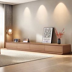 a living room filled with furniture next to a tall wooden wall mounted shelf on top of a hard wood floor