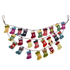 christmas stockings hanging from a line with numbers on them