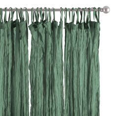 green curtains hanging from a metal rod on a white background with clippings to the side