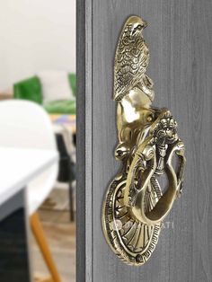 "Product Details ÿThis Bird Design Door Knocker Decorative Brass will look great on wooden doors so whether it's a new office, shop, or home. Designed smartly and skillfully to suit any kind of door, these door knockers and bells with a long-lasting finish are a must-have. Material:ÿBrass Size: 9.5\" L Xÿ 3.5\" Hÿ Weight: 830ÿgrams * This is a hand-made product and might vary slightly than what is shown in the images." Design Door, Gautama Buddha, Office Shop, New Office, Star Wall, Bird Design, Wooden Doors