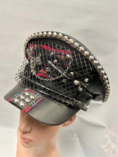 This is a black leatherette captain hat. Well made to a high standard. It has plenty of eye catching detail including metal studs, safety pins , please refer to photos . This is a size 59 cm which fits most size heads. No two hats are created the same. Individual and unique  Thank you for looking Adjustable Punk Costume Hats And Headpieces For Cosplay, Punk Style Adjustable Costume Hats For Cosplay, Punk High Crown Top Hat For Cosplay, Punk Style Top Hat With High Crown For Cosplay, Adjustable Punk Mini Hat For Cosplay, Black Punk Brimmed Hats, Black Brimmed Punk Hat, Black Punk Top Hat For Alternative Fashion, Black Adjustable Punk Mini Hat