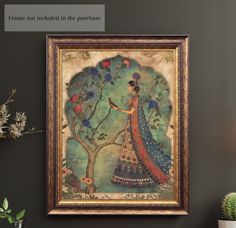 a painting hanging on the wall next to a potted plant and vase filled with flowers