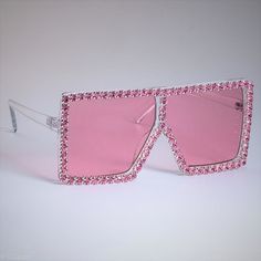 Another stunning version of our Como shades! How nice are these? Complete with crystal/rhinestone embellishments for the ultimate bling! They'll have you standing out from the crowd for all the right reasons! Style: Square with crystal embellished frame. Lens Height: 6.5 cm Lens Width: 6.8 cm UV400 Protection Luxury Elegant Shield Sunglasses For Party, Elegant Luxury Shield Sunglasses For Parties, Luxury Rimless Shield Sunglasses For Formal Events, Cheap Elegant Rhinestone Sunglasses, Luxury Rimless Shield Sunglasses For Formal Occasions, Candy Frame, Pretty Sunglasses, Big Glasses, Luxury Glasses