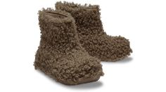 This "it" boot is functional and versatile for any occasion, with year-round appeal for those looking for bold, unique, iconic style. Part of the new Crush collection, this dynamic new boot features modern style, added heel height, and trend-right, easy to wear ankle boot height. This version features a soft and fuzzy faux fur covered upper. The Crocs comfort you love, with an extra dose of height, attitude, and style.  Crush Doodle Fur Boot Details:    Soft and fuzzy faux fur covered upper   Easy to wear boot height  Croslite™ material construction makes it incredibly light & comfortable  Unique 2.2-inch / 5.5cm height, measured from floor to heel rest  Iconic Crocs Comfort™: Lightweight. Flexible. 360-degree comfort. New Crush, Crocs Boots, Iconic Style, Fur Boots, Style Crush, 360 Degree, Style Icons, Modern Style, Faux Fur