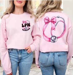 This Personalized LPN Crewneck Sweatshirt is the perfect gift for Licensed Practical Nurses. With a cute design and customization options, it adds a touch of warmth and style to their wardrobe. Ideal for LPNs looking for cozy and durable apparel to wear during the colder months. Suitable for gifting on Nurse's Day, birthdays, or as a thank you gesture. ♡ DETAILS: .: Printed on a Gildan 18000 sweatshirt .: Medium-heavy fabric .: Loose fit .: Sewn-in label .: Runs true to size ♡ RECIPIENT IDEAS: - Cute Long Sleeve Custom Print T-shirt, Cute Customizable Long Sleeve Top, Customizable Cute Long Sleeve Top, Customizable Pink Tops For Fall, Customizable Cute Crew Neck Tops, Pink Long Sleeve Top Suitable For Gifting, Pink Long Sleeve Top As A Gift, Pink Long Sleeve Top With Custom Print, Cute Customizable Crew Neck Sweatshirt