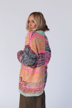 Wrap yourself in warmth with the Cross Creek Cardigan. These captivating colors will keep you cozy all year long! You're going to love this cardigan because it features: So cozy chunky knit fabric with an eye-catching multi color print throughout Loose and slouchy cardigan silhouette Classic open front closure Dropped shoulders with loose long sleeves Ribbed trim along the edges and wrist closures Pair with: Pacific Distressed Wide Leg Jeans, and Scoop Neck Bralette Tee for a casual look, or On Multicolor Knit Cardigan For Fall, Multicolor Sweater Coat For Fall, Multicolor Long Sleeve Sweater Coat For Fall, Multicolor Acrylic Sweater Coat For Fall, Multicolor Knitted Sweater Coat For Fall, Multicolor Knit Sweater Coat With Long Sleeves, Cozy Multicolor Sweater Coat For Fall, Multicolor Acrylic Sweater For Fall, Multicolor Knitted Outerwear For Fall