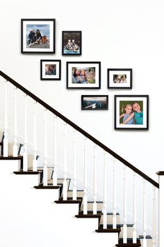 Black gallery wall of frames over a staircase. Photo Frames On Staircase Wall, Staircase Wall Frames Ideas, Home Decor Stairway Wall, Photo Frame Staircase, Stairs Frames Ideas, Staircase Gallery Wall Minimal, Gallery Wall Over Stairs, Staircase Frame Ideas, Staircase Wall Photo Gallery