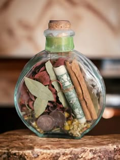 a glass bottle filled with money and spices