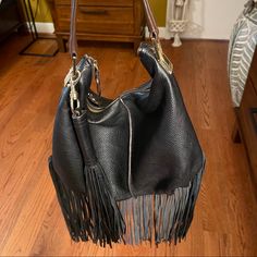 Leather Tote W/Fringe Tassel Has Obvious Signs Of Wear Such As Minimal Scratches On The Hardware. Clean Interior Chic Travel Hobo Bag With Fringe, Chic Fringe Hobo Bag For Travel, Chic Fringe Hobo Bag, Chic Leather Shoulder Bag With Tassels, Black Tasseled Hobo Bag, Chic Fringe Hobo Bag For Everyday, Black Hobo Bag With Tassels For Everyday Use, Leather Fringe Bag, Leather Fringe