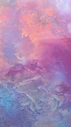 an abstract painting with pink, blue and yellow colors on it's surface is shown