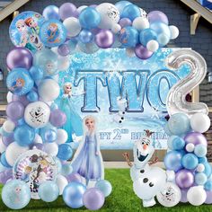 a frozen princess birthday party with balloons and decorations