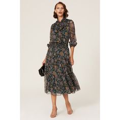 Floral printed crepe (100% Polyester). Blouson. Tie neck. Long sleeves. Tie closure. 52" from shoulder to hemline. Imported. Elegant Spring Midi Dress With Paisley Print, Elegant Patterned Printed Dress, Elegant Patterned Floral Print Maxi Dress, Elegant Floral Print Patterned Maxi Dress, Silk Midi Dress With Floral Print For Work, Elegant Paisley Print Dress, Chic Floral Midi Dress For Formal Occasions, Silk Printed Formal Dresses, Formal Silk Printed Dress