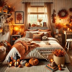 a bedroom decorated with pumpkins and candles