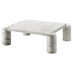 a white marble coffee table with two legs and one foot in the middle, against a white background