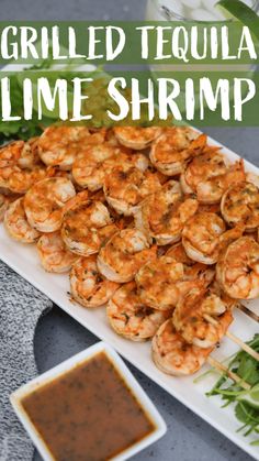 grilled tequila lime shrimp on a platter with dipping sauce