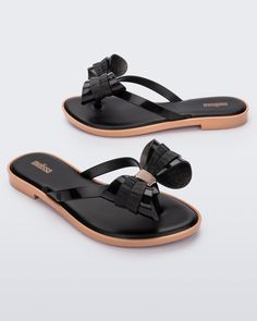 So lovely and luxe, the Slim Flip Flop brings bows to chic poolside style. Featuring a cushy footbed, metallic details and of course, ultra cute bow embellishments, slip these feminine flip flops on when you fancy some extra flair for a casual look. A little glam gets a lot of comfort.