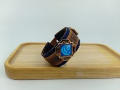 The product is made entirely by hand, premium genuine leather. Accessories are cooper and stainless steel. Specialized sewing thread for leather sewing The ring will be durable over time, the more you wear it, the more beautiful it will be. A great gift for gamers Each system we will change the color of the lining. Ex: in the picture is hydrogen with dark blue leather, if it is pyro, it will change to dark red leather. he leather on top will be brown or black or beige depending on your choice. Rectangular Leather Bracelet As A Gift, Rectangular Leather Bracelet Gift, Rectangular Leather Bracelet For Gift, Handmade Custom Leather Bracelet, Adjustable Leather Rectangular Wristband, Adjustable Rectangular Leather Wristband, Custom Handmade Leather Bracelets, Adjustable Leather Bracelet With Custom Hardware, Leather Strap Wristband As Gift