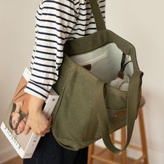 Overview： Design: Mens Army Green Canvas Large Tote Bag Canvas Handbag Canvas Tote for Men WomenIn Stock: Ready to Ship (2-4 days)Include: Only BagCustom: NoColor: Army GreenLeather: CanvasMeasures: 43cm x 34cm x 15cm Weight: 0.45kgSlots: 1 main slotAccessories(option): NoneStyle: Mens Army Green Canvas Large Tote Bag Canvas Handbag Canvas Tote for Men WomenVery durable (At least 5 Years) and it should last a life time Description: The Mens Army Green Canvas Large Tote Bag is a functional and st Khaki Canvas Satchel For Daily Use, Khaki Shoulder Bag With Canvas Lining For Daily Use, Everyday Khaki Shoulder Bag With Canvas Lining, Everyday Khaki Bag With Pockets, Canvas Travel Bag For Everyday Use, Large Capacity Tote Shoulder Bag For Outdoor, Casual Everyday Satchel With Canvas Lining, Practical Khaki Shoulder Bag For Travel, Khaki Large Capacity Satchel For Everyday Use