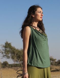 Style - The Float Neck style is a simple yet chic, low draping front neckline. For a higher front drape, view our Cocoon style. Shape - The Wanderer shape opens at the armpit into a full-bodied, flowy A-line design. Racerback - A highly functional T-shaped back. Size - Order based on BUST measurement Fabric Shown - Tissue Hemp/Organic Cotton Knit Color Shown - Blush, Seafoam Versatile Draped Summer Top, Summer Cowl Neck Top, Versatile Summer Cowl Neck Top, Versatile Cowl Neck Summer Top, Casual Summer Top With Cowl Neck, Summer Casual Cowl Neck Top, Casual Cowl Neck Top For Summer, Gaia Conceptions, The Wanderer