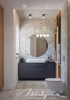 a bathroom with a toilet, sink and mirror in it's center wall area