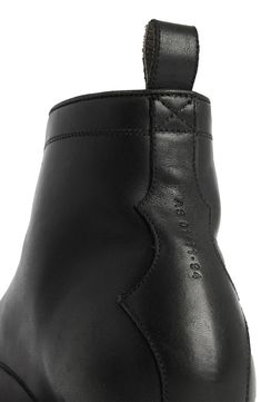 Crisp, monochrome design refines this cap-toe combat boot crafted from premium leather above a rugged rubber sole. 5" shaft Lace-up style Leather upper and lining/synthetic sole Made in Portugal Black High-top Lace-up Boots With Leather Lining, Black Leather Work Boots With Goodyear Welt Construction, Leather Waterproof Ankle-high Boots For Streetwear, Leather Combat Boots With Goodyear Welt For Work, Leather Combat Boots For Work, Classic Combat Boots With Lug Sole, Leather Cap Toe Chelsea Boots For Work, Leather Moc Toe Boots For Streetwear, Leather Combat Boots With Lug Sole