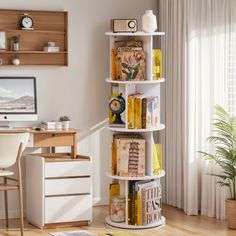 a room with a desk, computer and bookshelf in the corner next to a window