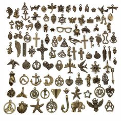 a large collection of antique and modern metal crosses, brooches, pendants