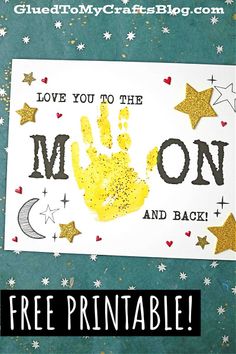 a handprinted card with the words i love you to the moon and back