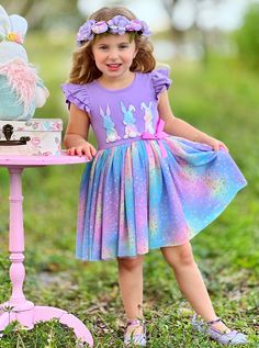 You've never seen an Easter tutu dress like this before! Bursting to the bring with color and cute style, the tiered flutter sleeves, embroidered bunnies, and ruched skirt will have your little girl smiling from ear to ear. Put this tutu dress front and center when the occasion calls for color and fun! SUPER soft and lightweight materials used in the skirt make it a dress she won't want to take off. Fully lined skirt gives her the confidence to move and play without worry. Perfect for Spring, Easter, school events, birthday parties, and year-round play Dress features scalloped flutter sleeves, a gradient rainbow polka dot bunny silhouette embroidered bodice with cotton tail applique, small ribbon bow at the waist, and a gradient rainbow polka dot mesh tulle skirt with full lining and elast Multicolor Playtime Dress For Easter, Multicolor Easter Playtime Dress, Whimsical Multicolor Twirl Dress For Spring, Playful Spring Twirl Dress With Ruffle Hem, Playful Purple Spring Dresses, Spring Twirl Dress With Short Sleeves For Dress-up, Short Sleeve Twirl Dress For Spring Dress-up, Cute Multicolor Twirl Dress For Spring, Spring Multicolor Twirl Dress With Flutter Sleeves