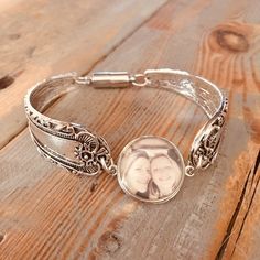 This is a listing for one custom silver spoon bracelet with 1 photo snap interchangeable charms.11/16" circle photo charms (18mm), 1 included, snap on and off easily3/4" wide boho spoon bracelet silver bangle bracelet with magnetic clasp for easy on and off, 7.5 inch aroundI will make this to order for you.   Have favorite pictures of a loved one, pet, friend, or saying? It can go on this charm! They are one sided resin sealed charms.  I can switch these out to the 12mm upon request.You will ema Antique Silver Round Cuff Bracelet Gift, Antique Silver Round Cuff Bracelet As Gift, Customizable Adjustable Vintage Jewelry, Adjustable Customizable Vintage Jewelry, Adjustable Silver Bracelet With Round Pendant, Antique Silver Round Bracelets For Gift, Antique Silver Round Bracelet For Gift, Antique Silver Bracelets, Silver Spoon Bracelet