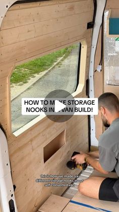 a man is working on the inside of a van with wood paneling and windows