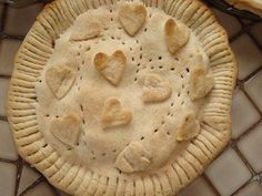 a heart shaped pie sitting on top of a table