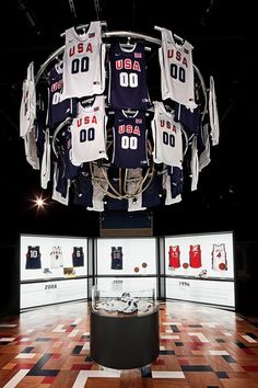 a basketball jersey display in the middle of a room