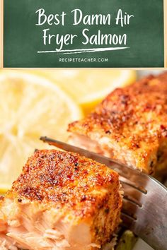 the best damn air fryer salmon recipe on a plate with a knife and lemon wedges