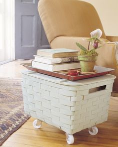 a white basket sitting on top of a wooden floor