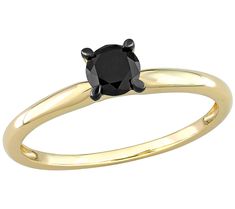 a yellow gold ring with a black diamond in the center, on a white background