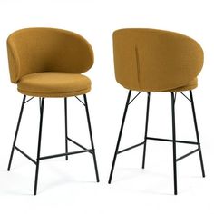 two yellow chairs sitting next to each other on top of a white floor with black legs