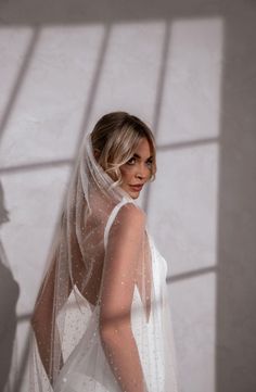 a woman in a wedding dress and veil