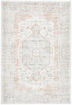 an orange and white area rug with a medallion design on the center, in front of a