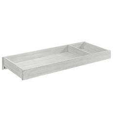 a white tray with two compartments on the bottom and one drawer in the middle, is shown