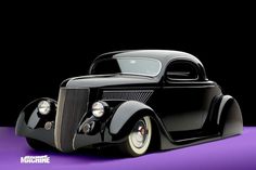 an old fashioned black car on a purple background