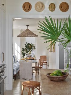 a dining room table that has some fruit on it