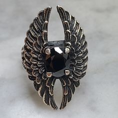 Vintage 925 Sterling Silver Angel Wings Ring for Ladies and Girls  Beautiful hand crafted ring set with a black CZ faceted crystal. Timeless design with some black oxidizing. Hallmarked with 925 stamp on the inside. USA SIZE 9 3/4 Black Faceted Rings For Gift, Gothic Black Ring Stamped 925, Black Oxidized Promise Ring, Gunmetal Ring Jewelry Gift, Gunmetal Ring Jewelry As Gift, Black Oxidized Rings For Anniversary, Black Oxidized Finish Rings Gift, Gift Black Ring With Oxidized Finish, Sterling Silver Ring With Black Diamonds For Gift