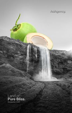 a green apple sitting on top of a rock next to a waterfall with water coming out of it