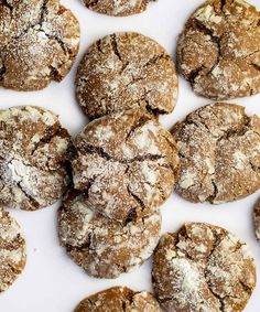 several cookies with powdered sugar on them are arranged in a square pattern and placed next to each other